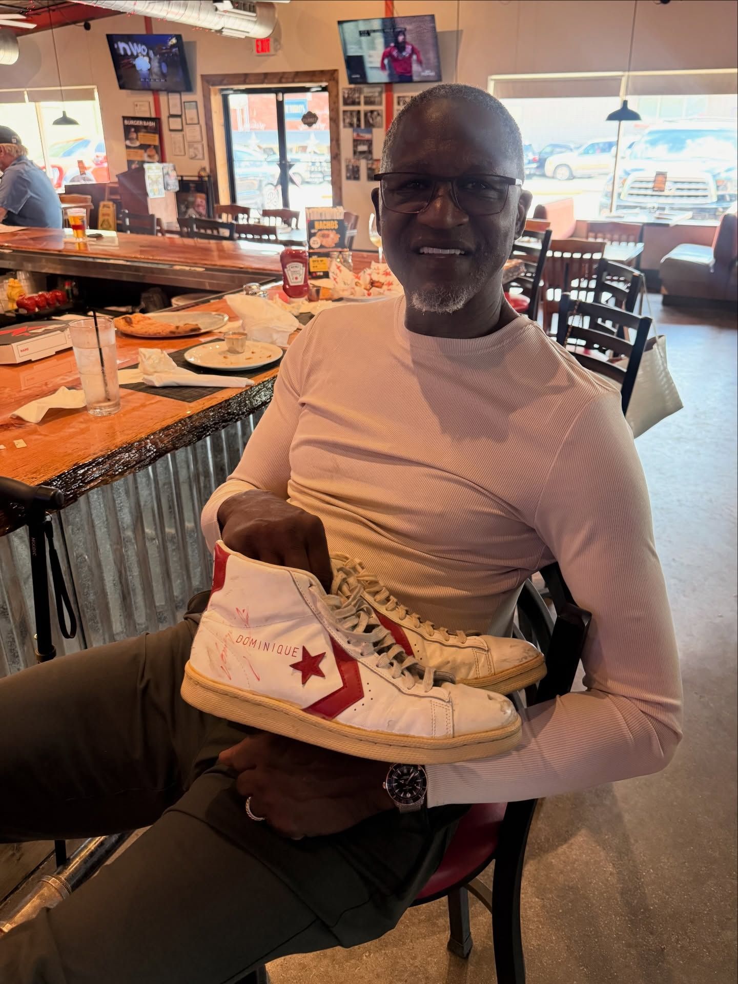 Dominique Wilkins with the Converse Pro Leather Player Exclusive he gifted a young fan back in the day.